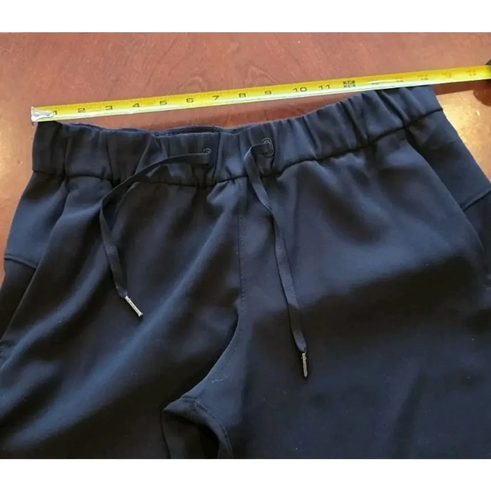 Lululemon On The Fly Black Drawstring Crop Pants Size 8 W6AVMS Athletic Casual